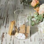 AW BRIDAL "I Love You Because" memory jar with a bamboo lid and 50 blank kraft paper cards spilling out.