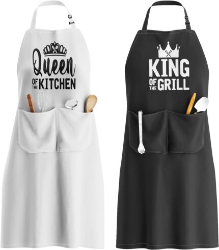 Two King and Queen aprons, one white and one black, with crowns and text, in an elegant gift box.