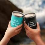 A black and a mint 20oz LiqCool travel tumbler, one with 'One Great Fisherman' and the other 'Best Catch of His Life' text.