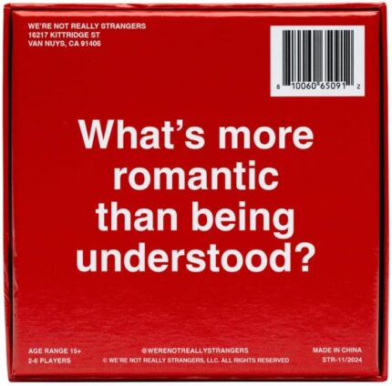 WE'RE NOT REALLY STRANGERS Couples Edition card game box with scattered conversation cards