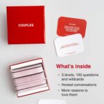 WE'RE NOT REALLY STRANGERS Couples Edition card game box with scattered conversation cards