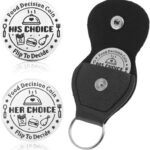 A silver, round stainless steel coin with 'Ymapinc' engraved, displaying food choices on one side and date night ideas on the